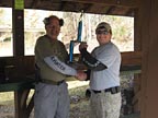 Sonny accepting the trophy from IDPA Committee Chairman, Dave White for winning the Top Gun Match at Rivanna Rifle and Pistol Club in Charlottesville, VA in November of 2009.