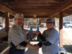 Sonny receiving the Top Gun Trophy from IDPA Match Director Dave Schullery at Rivanna Rifle and Pistol Club in Charlottesville, Va. in November 2010.